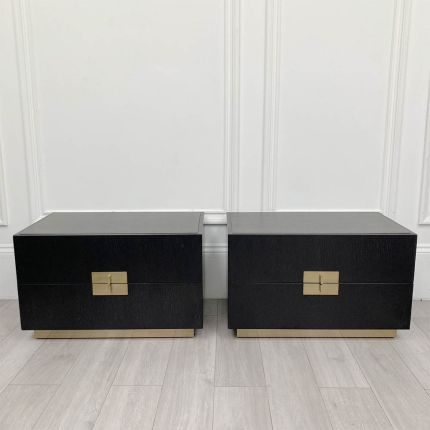 Bedside table with two drawers and brass details.