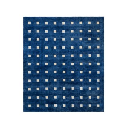 Navy blue viscose rug with small cream square pattern