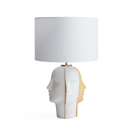 A lavish four sided side lamp with gold features