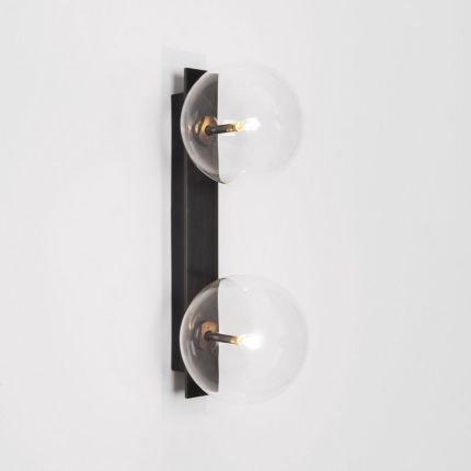A chic, double light wall lamp with glass lampshades and a black gunmetal finish