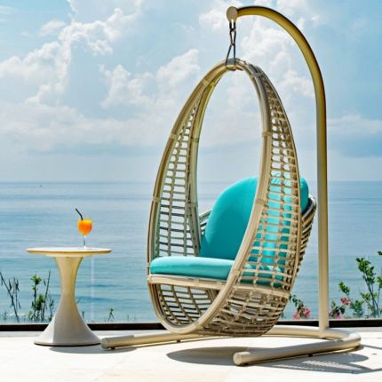 A luxury outdoor hanging swing chair from Willow's Outdoor collection with a beautiful bespoke upholstery 