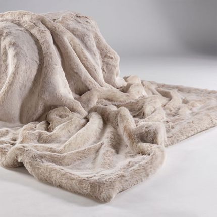 A sumptuous Alaska Fox Fur Throw in a beige colour with a faux suede reverse