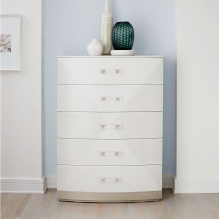 white dresser with dent on rear