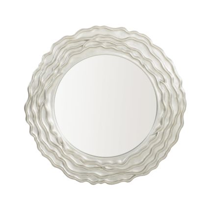 A gorgeous wall mirror featuring a textured wooden frame with layered waves and a silver finish