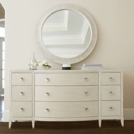 A gorgeous dresser from Bernhardt with a natural finish, tarnished nickel accents and nine drawers