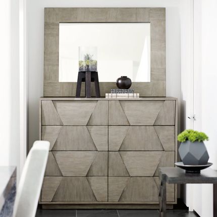 A luxurious and sophisticated eight drawer dresser with a unique dimensional design 
