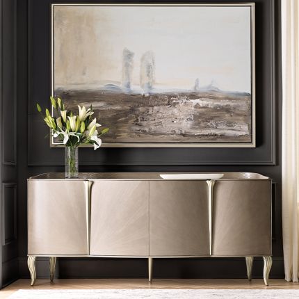 A luxury sideboard by Caracole with Art-Deco inspired inlay and a champagne finish