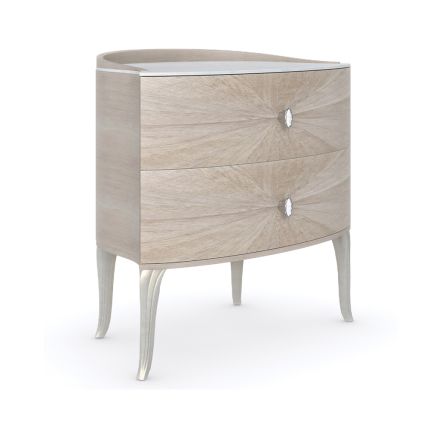 An elegant bedside table with a chic and curvaceous design 