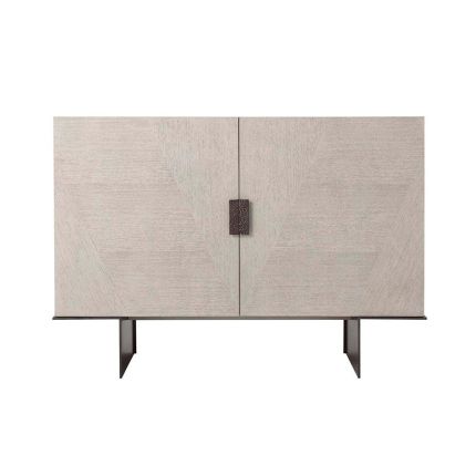 Stylish cabinet in white washed finish with hammered bronze handles