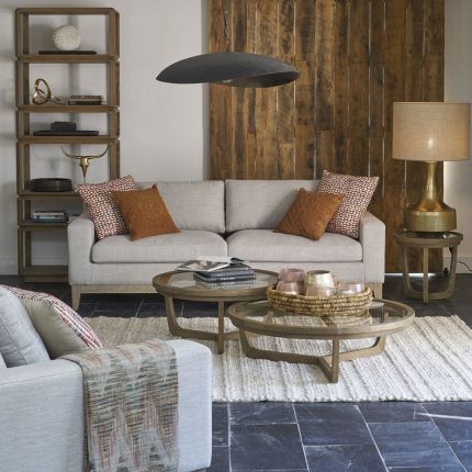 A luxurious modern cosy sofa with beige upholstery  