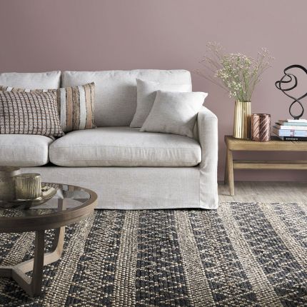A luxurious sand-toned sofa with removable covers