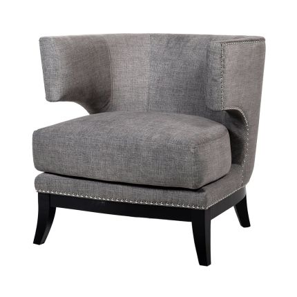 an occasional wingback armchair with silver studding 