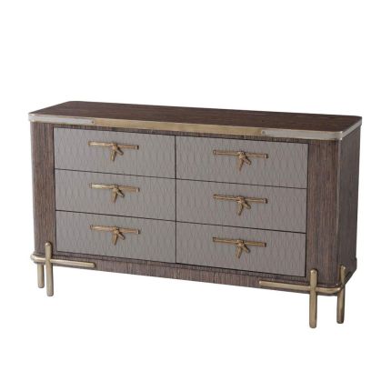 Captivating chest of drawers with bow effect handles and brass accents