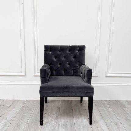 Contemporary, deep buttoned dining armchair with piping detail