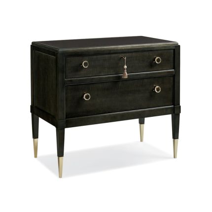 A timeless bedside table with gold and tassel details 