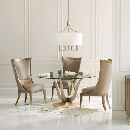 Divine dining table with champagne coloured tulip base with glass top