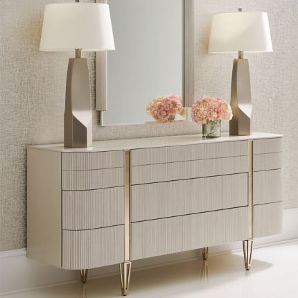 Elegant dresser with ribbed effect on drawers and captivating champagne gold details