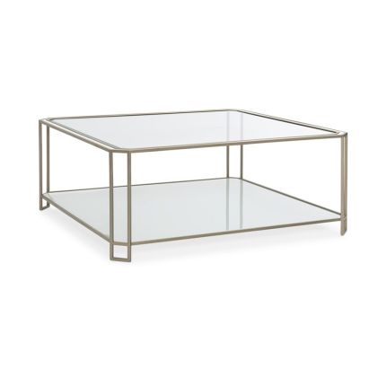 A modern coffee table with a minimal design featuring a glamorous gold frame and beautiful bevelled glass edges