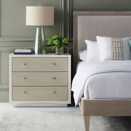 Contemporary bedside chest with clear acrylic handles and textured front of drawers