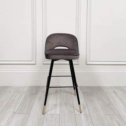 Luxurious grey counter stools with black piping and gold details