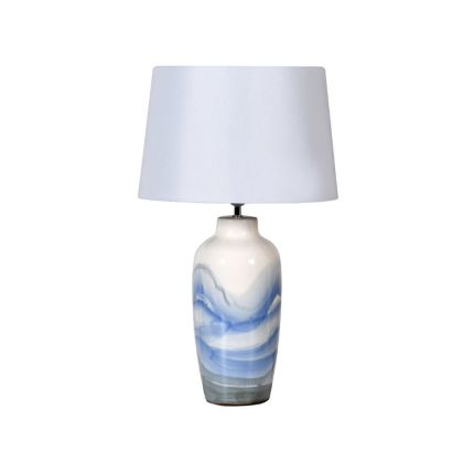 A luxurious handpainted table lamp with a white linen shade