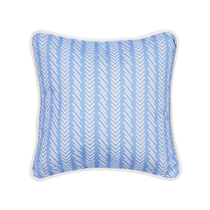 A blue children's cushion with a white pattern and sleek piping 