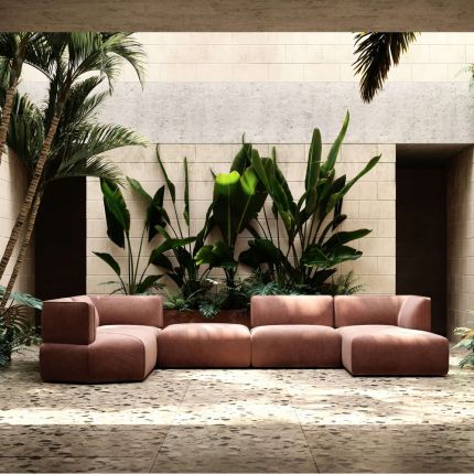 Luxury, large sofa upholstered in pink velvet, with curvy, contemporary design