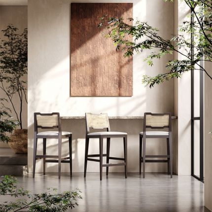 A traditional Portuguese-style counter stool with a weave upholstery and rattan back