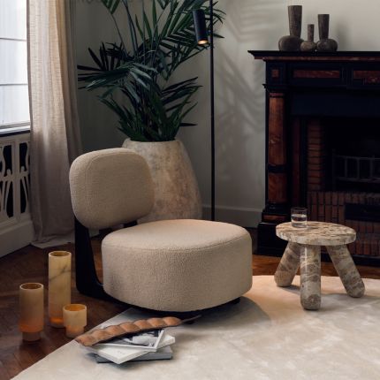 A luxury bespoke chair by Dome Deco with a dark walnut finish