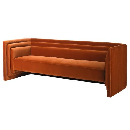 A retro sofa with a luxury orange cotton velvet upholstery and grooved details