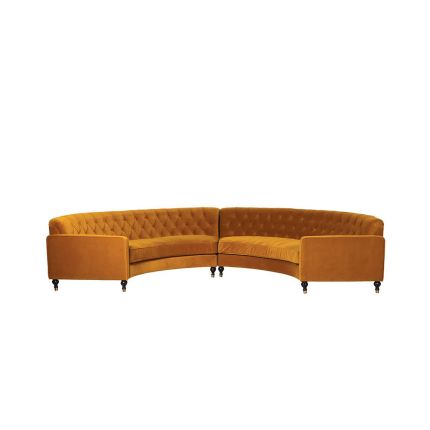 A stunning retro-inspired curved sofa with saffron-coloured upholstery 
