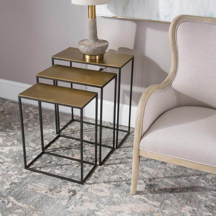 Set of three nesting tables with gold finish surface