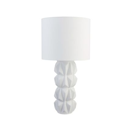 A textured and sculptural white table lamp by Jonathan Adler with an angular finish