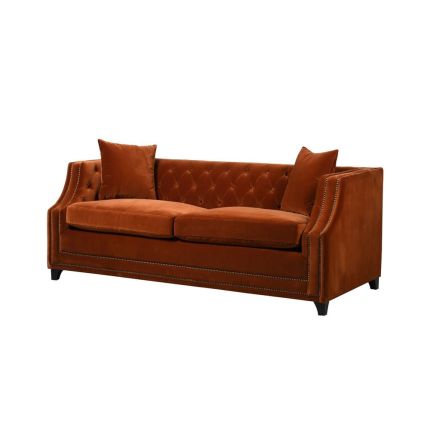 burnt orange sofa bed with deep buttoning and bronze studding 