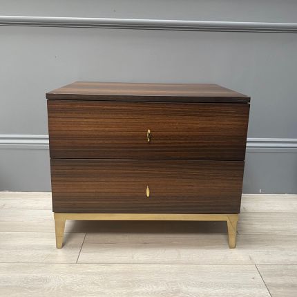 A luxurious smoked oak and gold metal bedside table