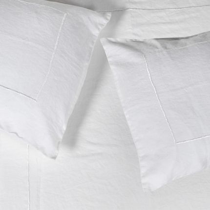 Delightful white linen bedspread with outline detail