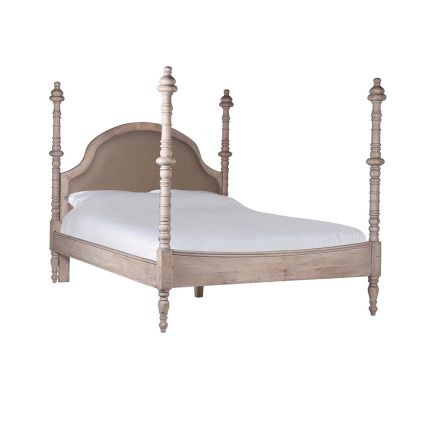 An elegant, four poster bed crafted from acacia wood and linen 