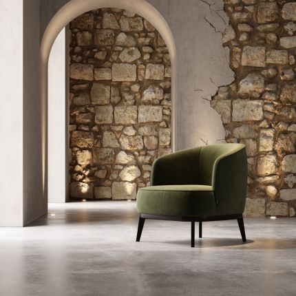 a luxurious round, green retro-inspired armchair 