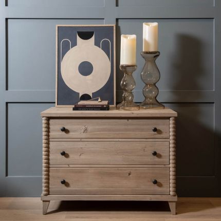 Natural wood chest of drawers with bobbled edges