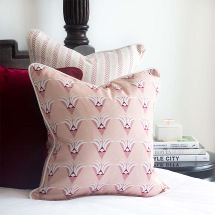A gorgeous, art deco inspired cushion with multiple shades of pink and white
