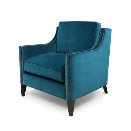 An elegant and cosy armchair with bronze studding 