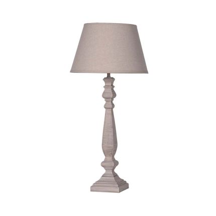 A stunning wooden table lamp with a beige cotton shade