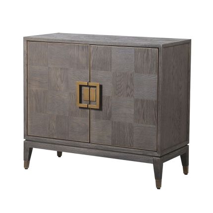A luxurious 2 door cabinet with interior shelving and antique brass accents
