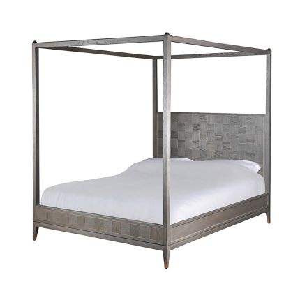 A luxurious four-poster bed with a distinctive cubed finish 
