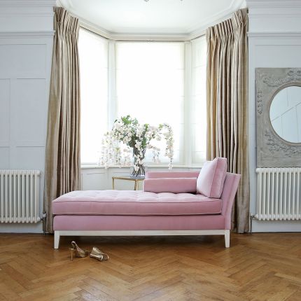 Luxury lounge, chaise longue with soft lined design and a bolster cushion