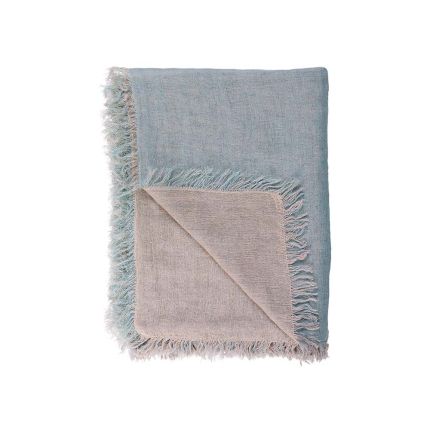 A handwoven linen throw in a pastel blue