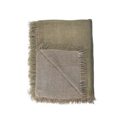 A handwoven linen throw in a natural sage green