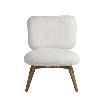 A luxurious faux shearling armchair with natural oak frame