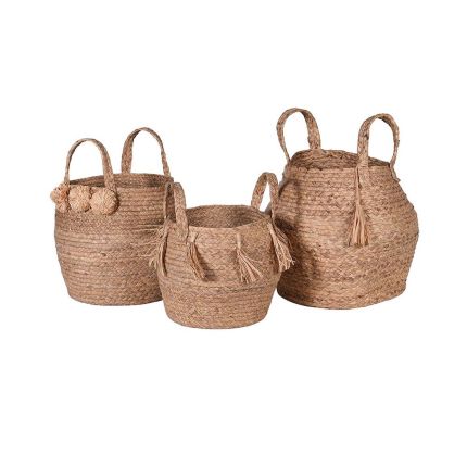 Set of three natural rattan baskets with pompom and tassel details