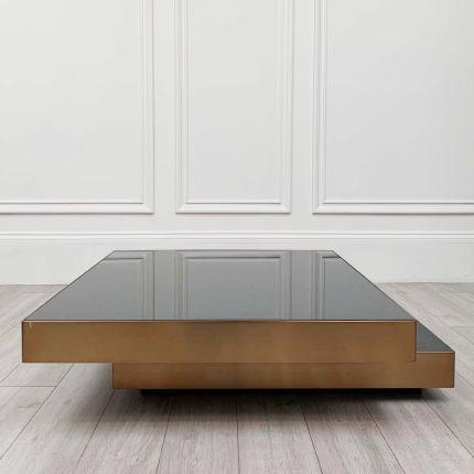 Overlapping square design coffee table with a brushed brass rim.